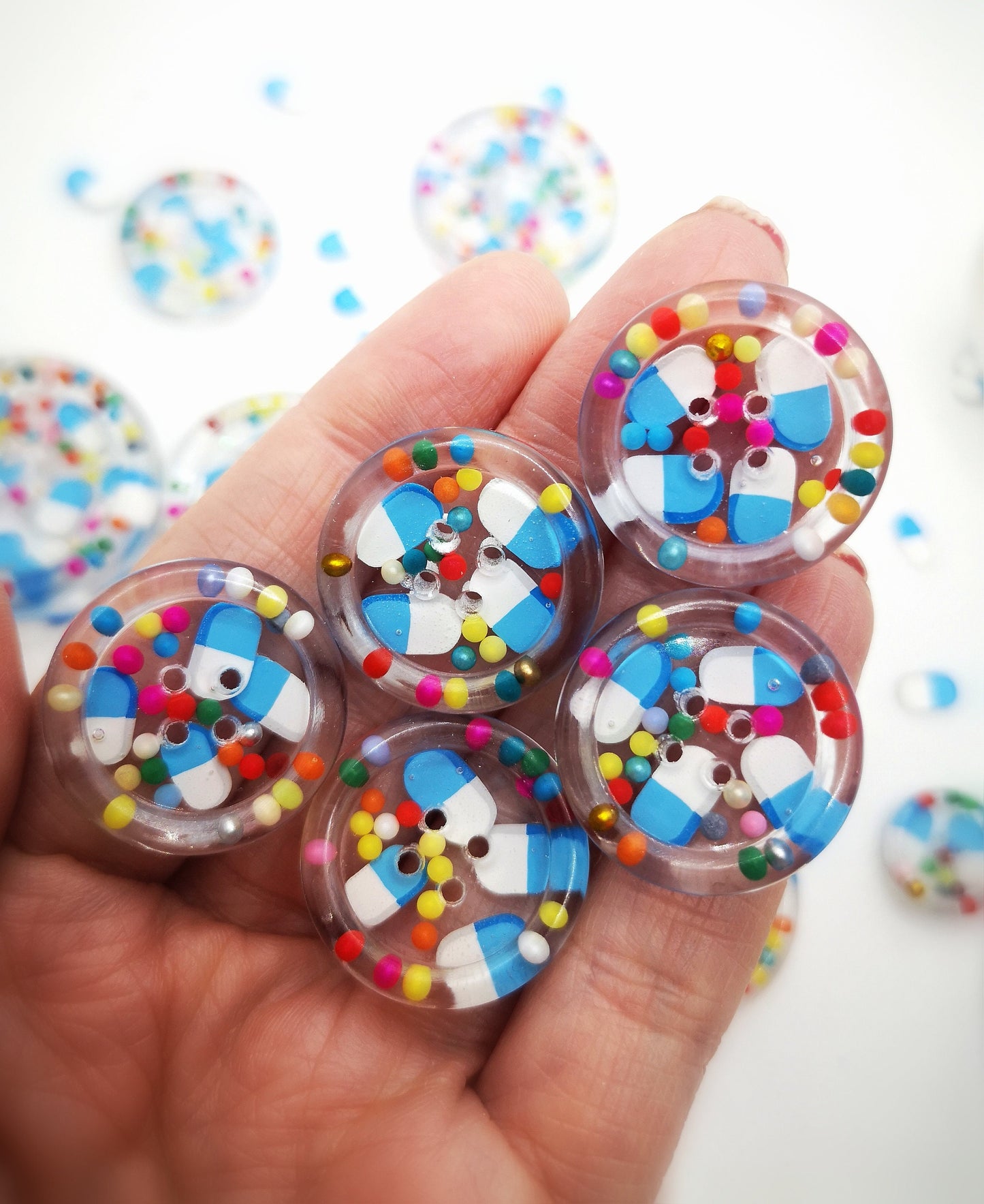The Pharmacy. Clear handmade fake pill art buttons with rainbow dots