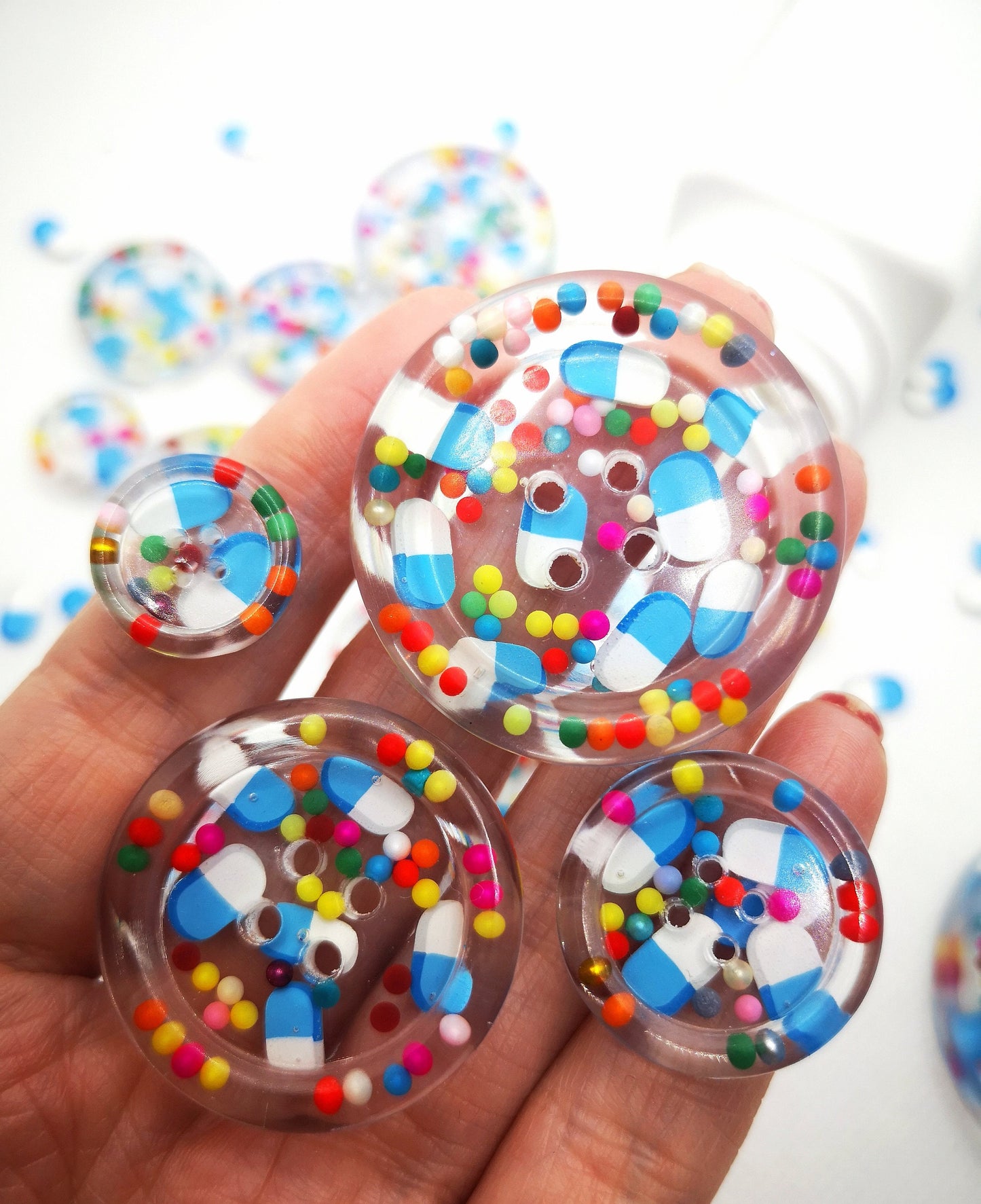 The Pharmacy. Clear handmade fake pill art buttons with rainbow dots