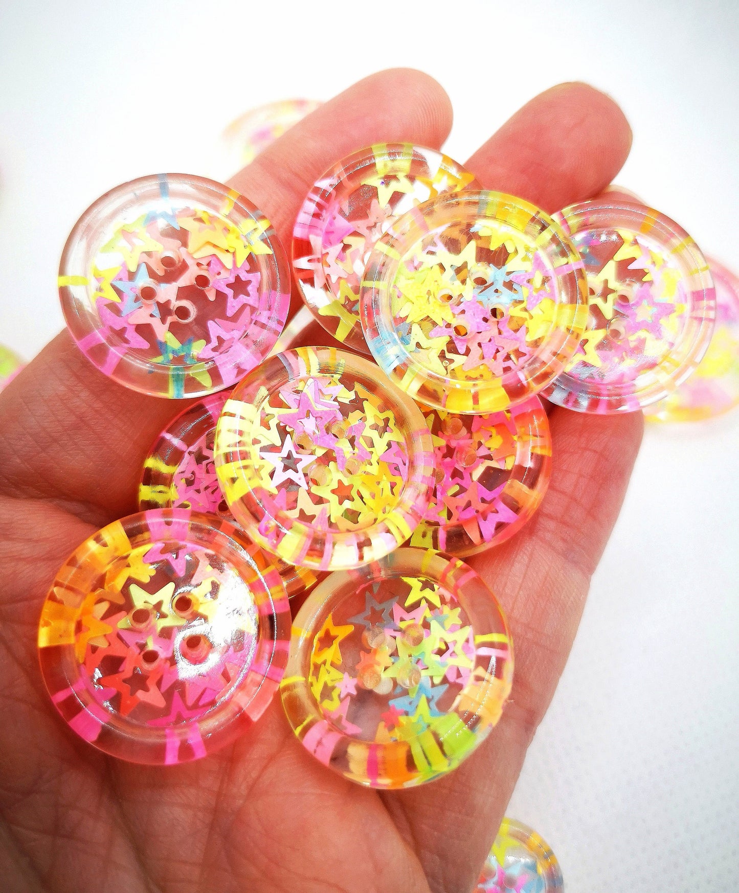 The Stars in Their Eyes button – Glossy Transparent Button with pearly Neon Star Magic