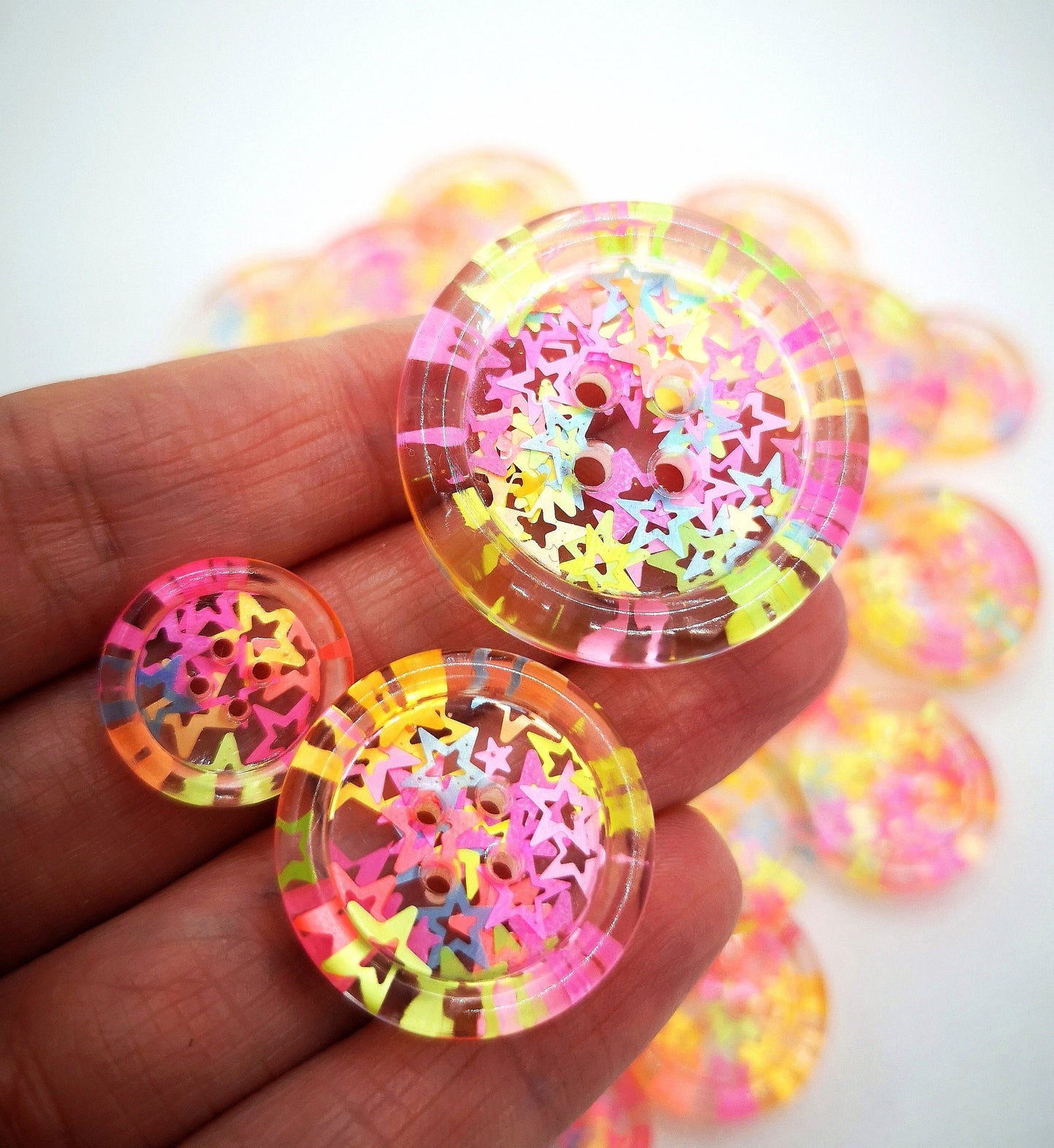 The Stars in Their Eyes button – Glossy Transparent Button with pearly Neon Star Magic