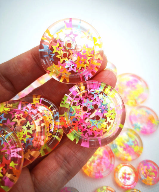 The Stars in Their Eyes button – Glossy Transparent Button with pearly Neon Star Magic