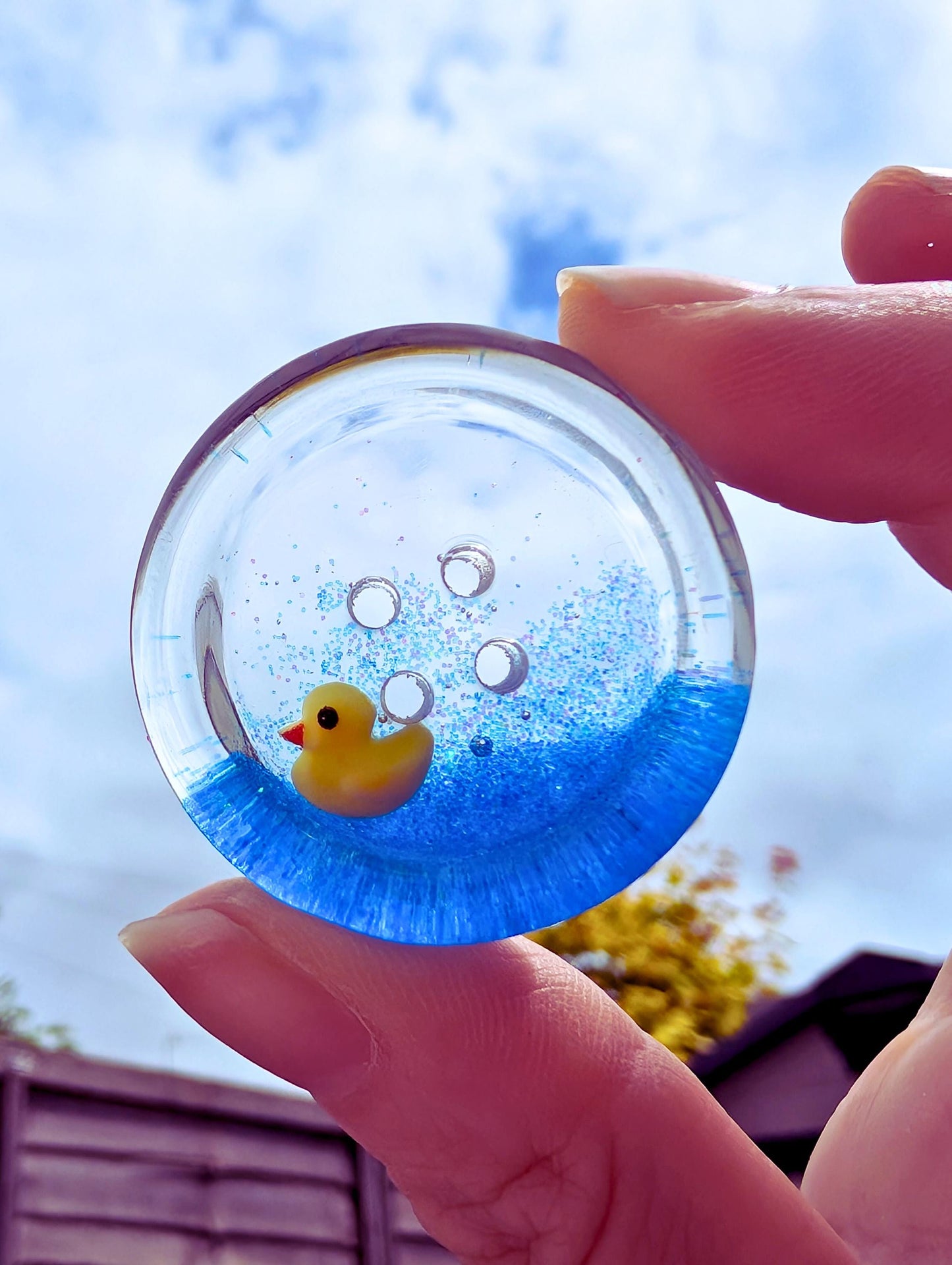 The Feeling Ducky Button – Sparkly Blue Transparent Resin Button with Floating Rubber Duck