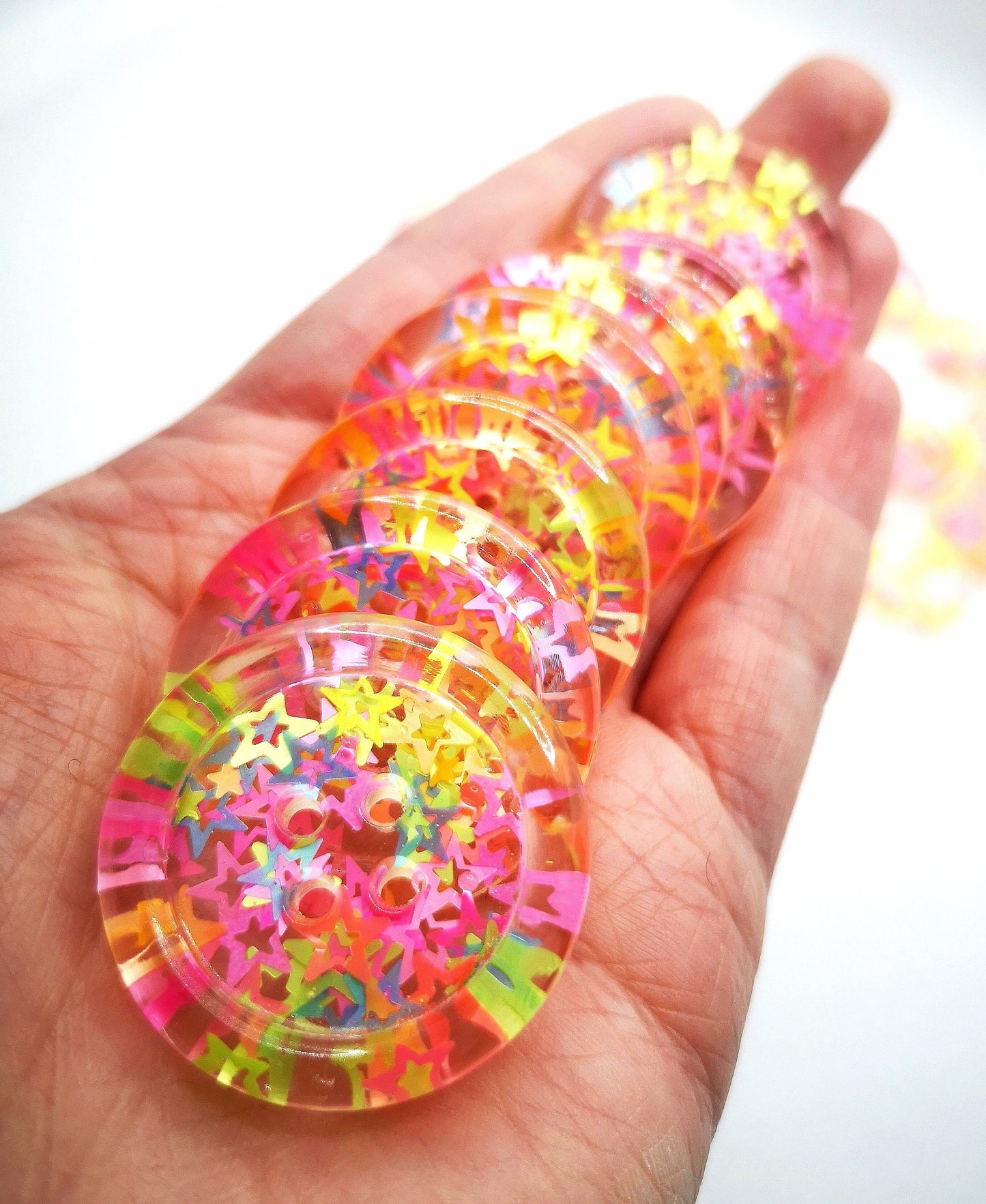 The Stars in Their Eyes button – Glossy Transparent Button with pearly Neon Star Magic