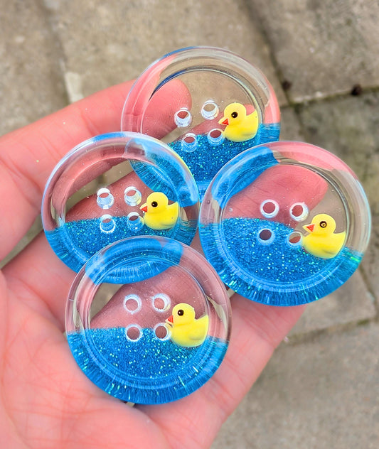 The Feeling Ducky Button – Sparkly Blue Transparent Resin Button with Floating Rubber Duck