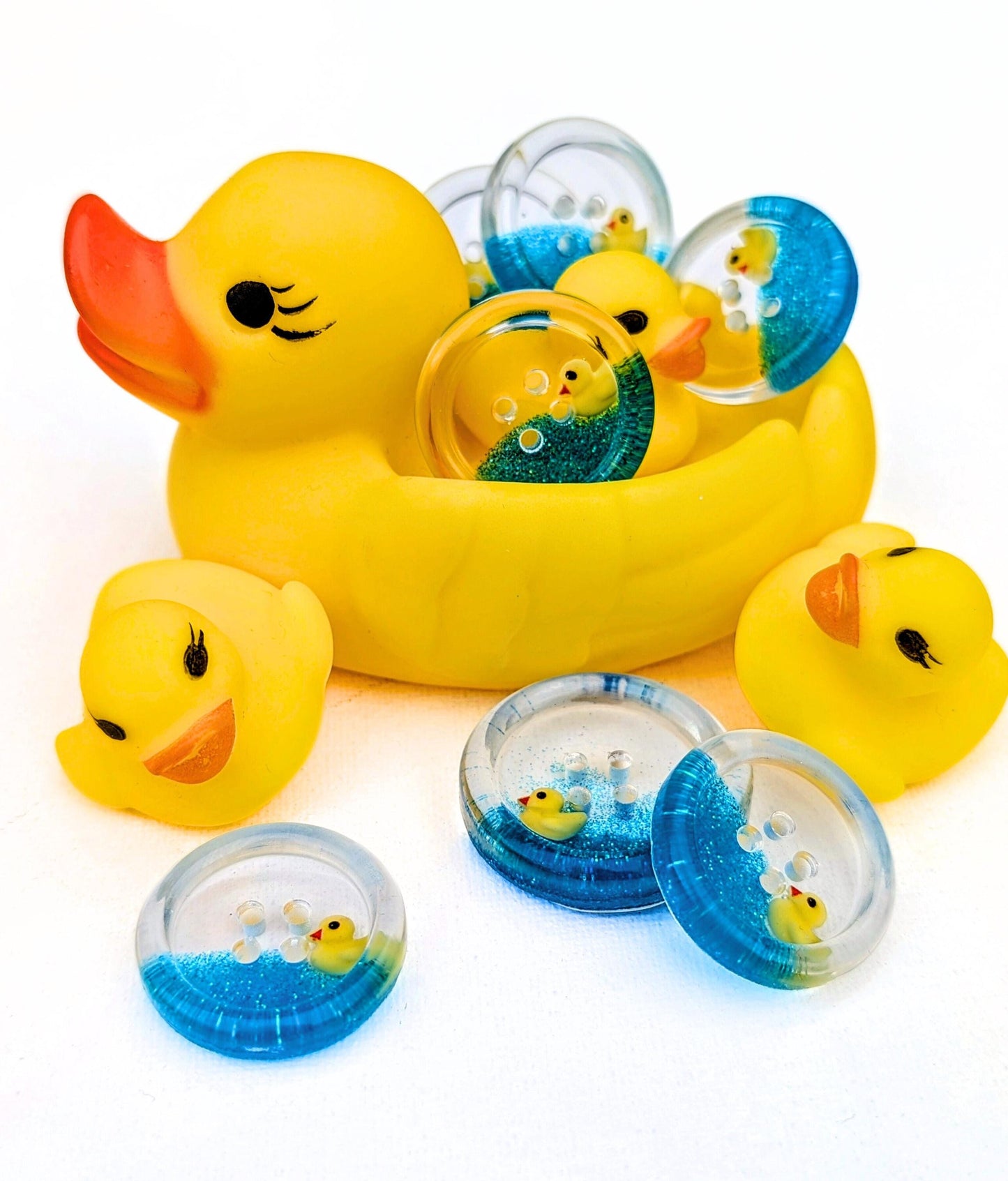 The Feeling Ducky Button – Sparkly Blue Transparent Resin Button with Floating Rubber Duck