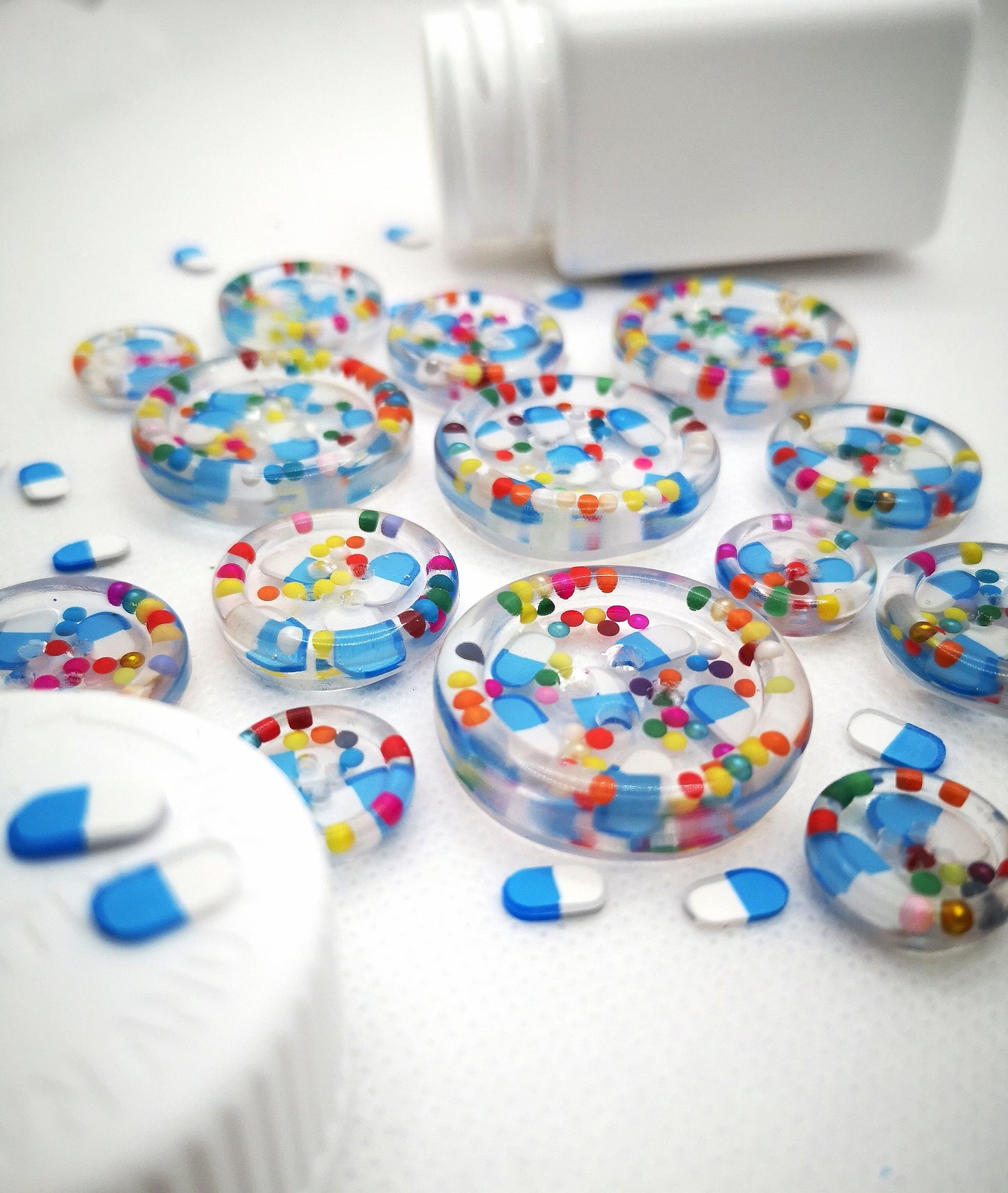 The Pharmacy. Clear handmade fake pill art buttons with rainbow dots
