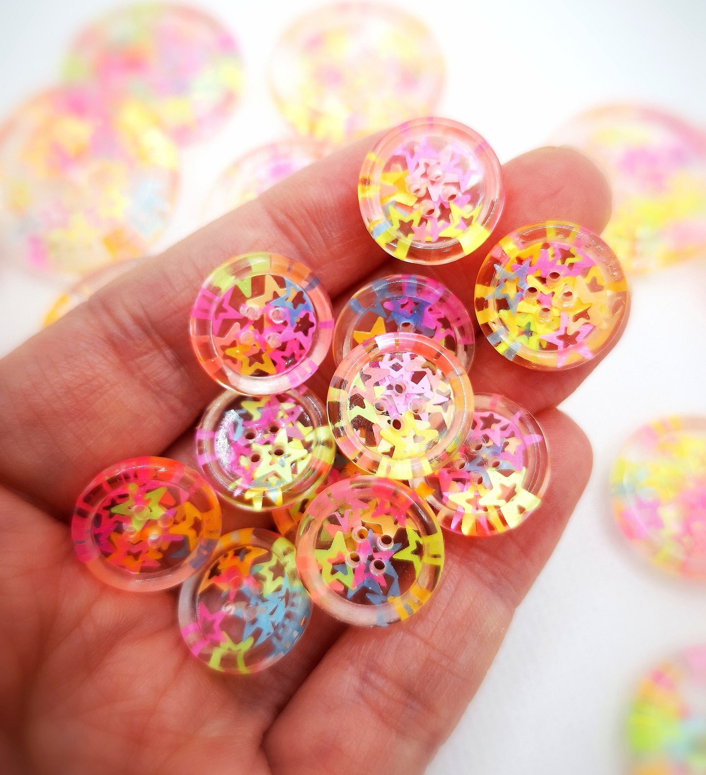 The Stars in Their Eyes button – Glossy Transparent Button with pearly Neon Star Magic