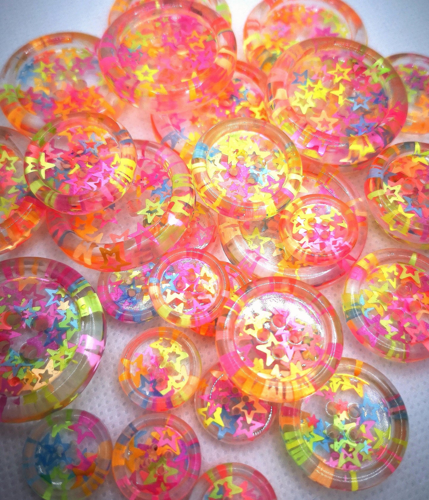 The Stars in Their Eyes button – Glossy Transparent Button with pearly Neon Star Magic
